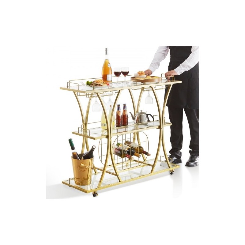 Kolmitasoinen kullanvärinen teräsrunkoinen baarikärry karkaistuilla lasihyllyillä ja lukittavilla pyörillä