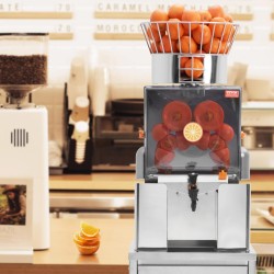 Ammattikäyttöinen automaattinen appelsiinimehupuristin SUS304 ruostumaton teräs PC-suojakansi vesihana 25 appelsiinia minuutissa