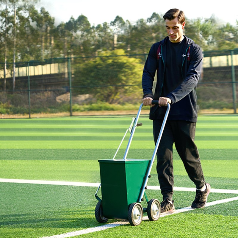 Kuivajauheviivamerkitsin hiiliteräsrunko 22,7 kg kapasiteetti säädettävä viivanleveys 7-tuumaiset metallipyörät urheilukentille