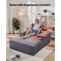 Lepotuoli tilava harmaa keinoturkisverhoilulla jousituksella ja heittotyynyillä