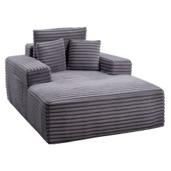 Lepotuoli tilava harmaa keinoturkisverhoilulla jousituksella ja heittotyynyillä